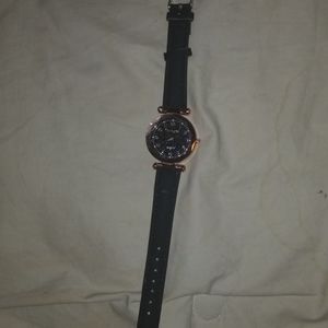 NWOT black and gold Watch